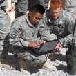 Photo of U.S Army soldiers testing a Harris PRC-117G software-defined radio.
